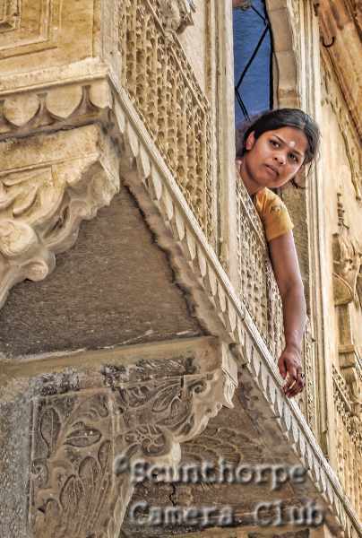 Girl at a high window 